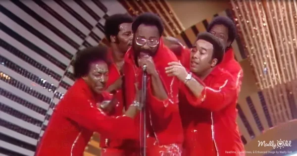 A vibrant 1970s television studio with The Spinners performing