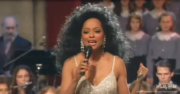 Diana Ross performs in an ornate Viennese concert hall, wearing an elegant gown that catches the light. The Vienna Symphony Orchestra surrounds her on stage while golden holiday decorations adorn the classical architecture.