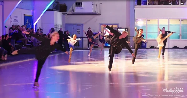 Historic ice skating rink interior with ornate architectural details and dramatic lighting. Figure skaters in elegant costumes performing on pristine ice surface with dramatic spotlights and ethereal atmosphere.